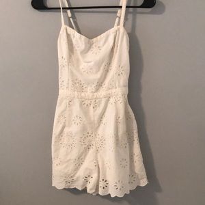 white hollister romper with floral eyelet pattern